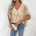 Tan brocade patterned blouse